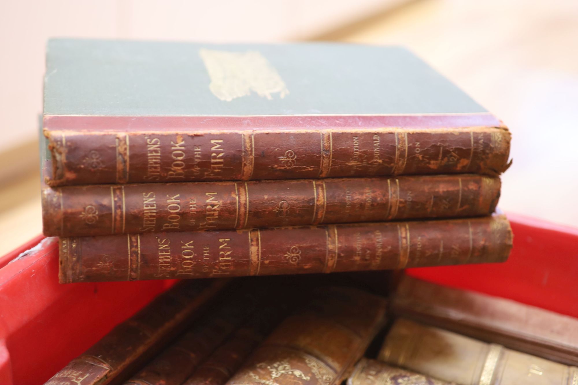 Three boxes of various decorative bindings